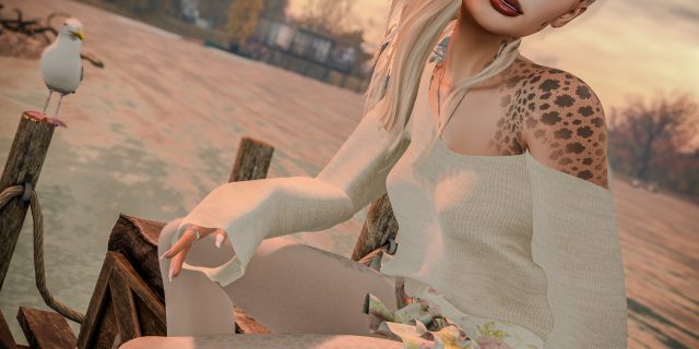 Annika Mohegan im Carley-Look von Asteria: Strickbluse in Ivory mit offenen Schultern und Volantrock mit Rosenmuster, fotografiert im Herbst auf Luanes World in Second Life