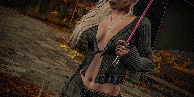 Annika Mohegan im Giselle-Look von Carol's: schwarzer Rippstrick-Cardigan und schwarzer Rock mit Spitzenvolants, fotografiert im Herbstregen auf Cherishville in Second Life